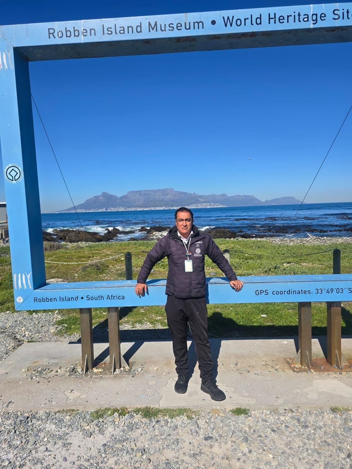 Your guide in the Robben Island frame with Table Mountain across the water